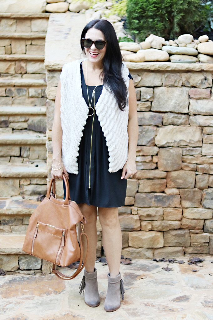 fur-vest-black-dress-brown-bag