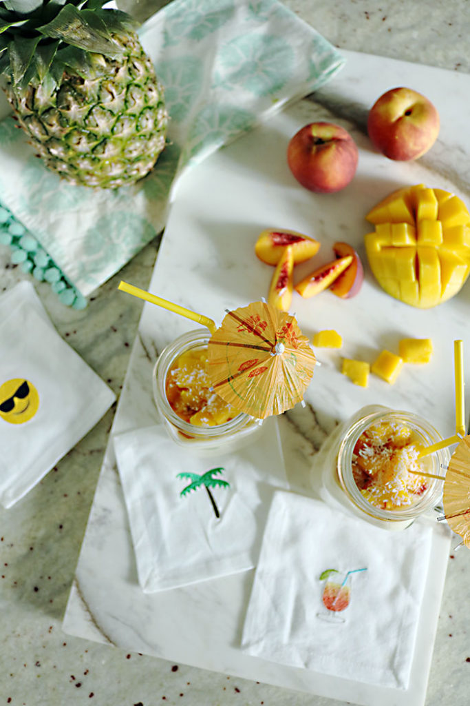 coconut-cream-smoothie-with-tropical-fruit, emoji cocktail napkin, mango, pineapple, peach, banana