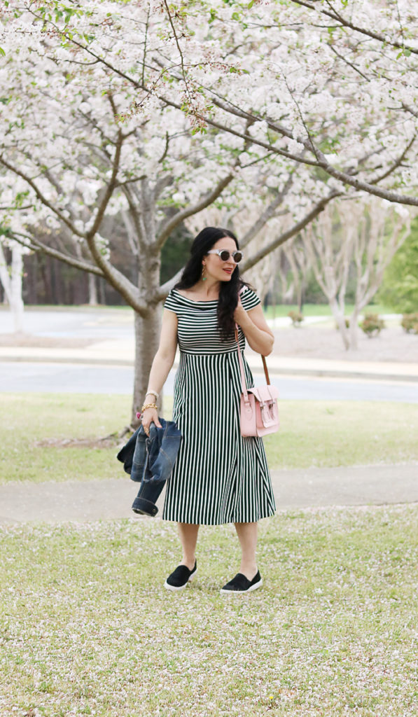 stylish ways to wear a dress with sneakers, sneaker dress outfit, casual black and white dress with sneakers, british made satchel tote, jean jacket, converse slip on sneakers, spring fashion casual outfit