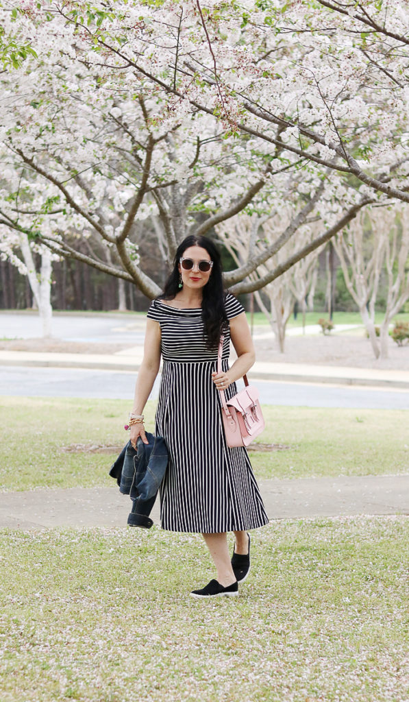 stylish ways to wear a dress with sneakers, sneaker dress outfit, casual black and white dress with sneakers, british made satchel tote, jean jacket, converse slip on sneakers, spring fashion casual outfit