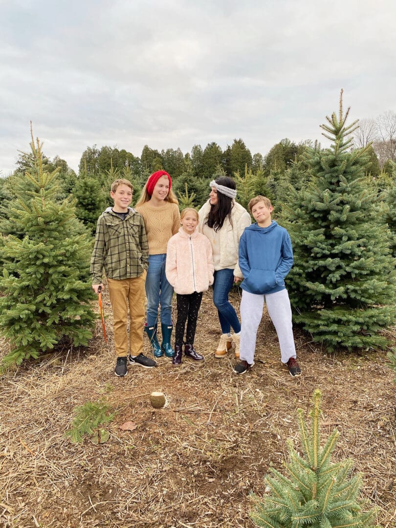 Our annual family tradition brings us to the Christmas Tree farm to find the perfect Christmas tree to cut down and bring home to decorate! Cutting down Christmas Tree.  Christmas tree cutting outfits || Darling Darleen Top Lifestyle Blogger 