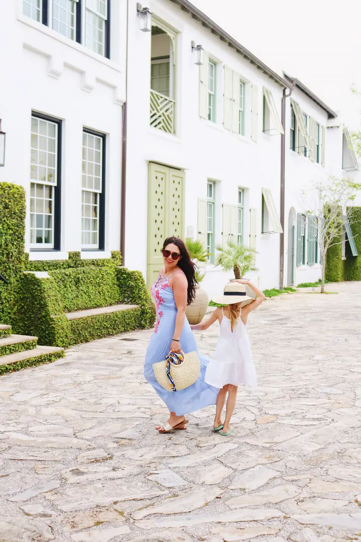 Walking around Alys Beach with daughter in hand in our beach vacation maxi dresses.  We love how beautiful this area of 30A florida | what maxi dress to pack for a beach trip || Darling Darleen 