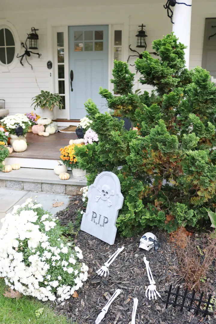Our not-so-spooky front porch Halloween decorations with spiders and skeletons!  || Darling Darleen Top CT Lifestyle Blogger #halloweendecorations