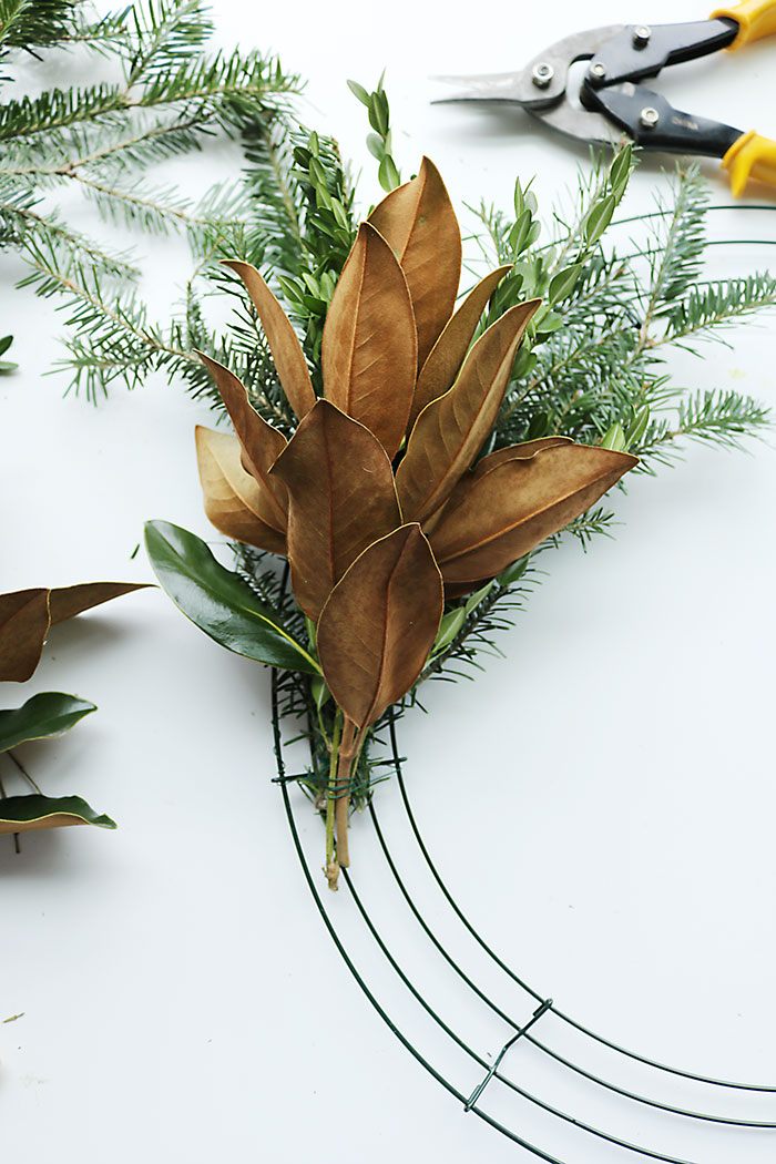 magnolia-wreath-tying-to-wire - Darling Darleen | A Lifestyle Design Blog